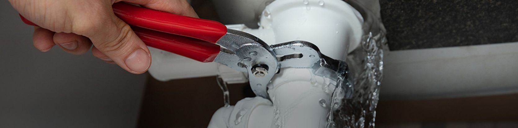 wrench on a plumbing pipe